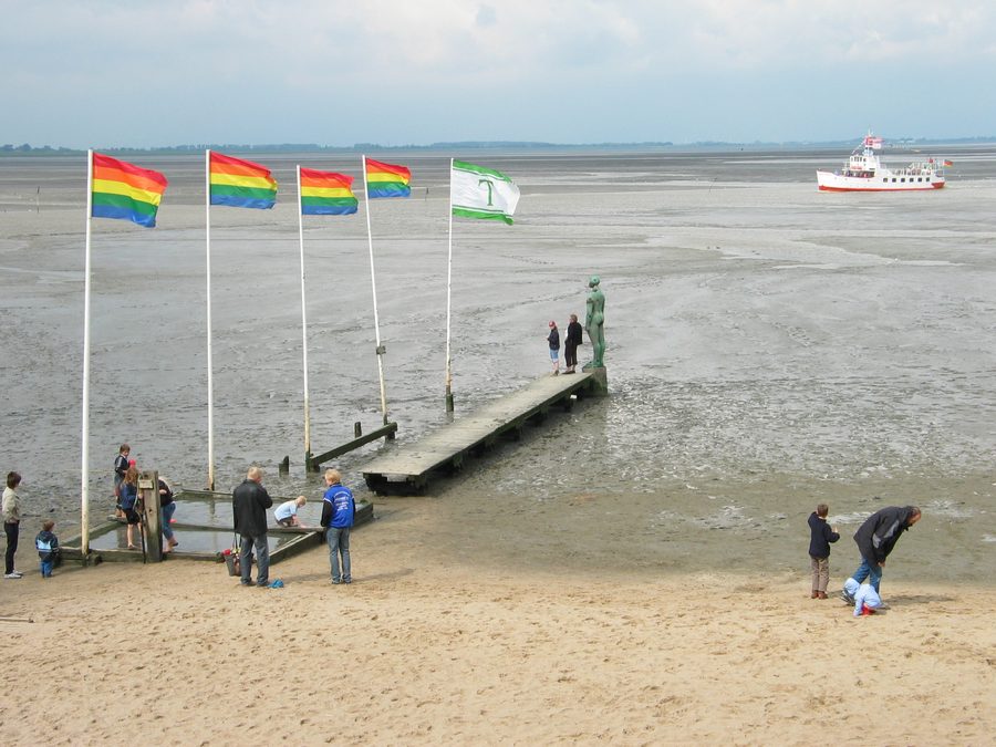Beach in Dangast with a pier and the ships Jade and Etta of Dangast.