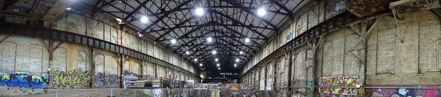 Panorama of the warehouse at the Carrie Blast Furnaces National Historic Landmark with an industrial steel structure.