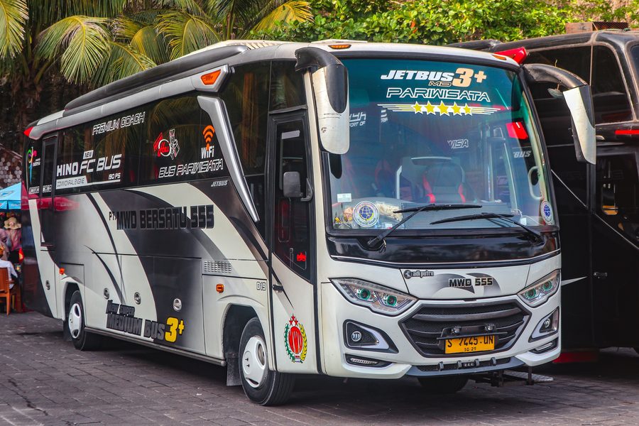 Melasti Beach in Ungasan, South Kuta, Bali, Indonesia, with a bus on the beach access road