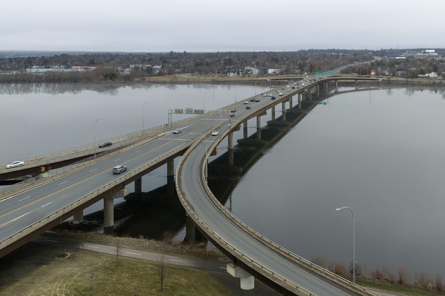Westmorland Street Bridge over the Saint John River in Fredericton in daylight.