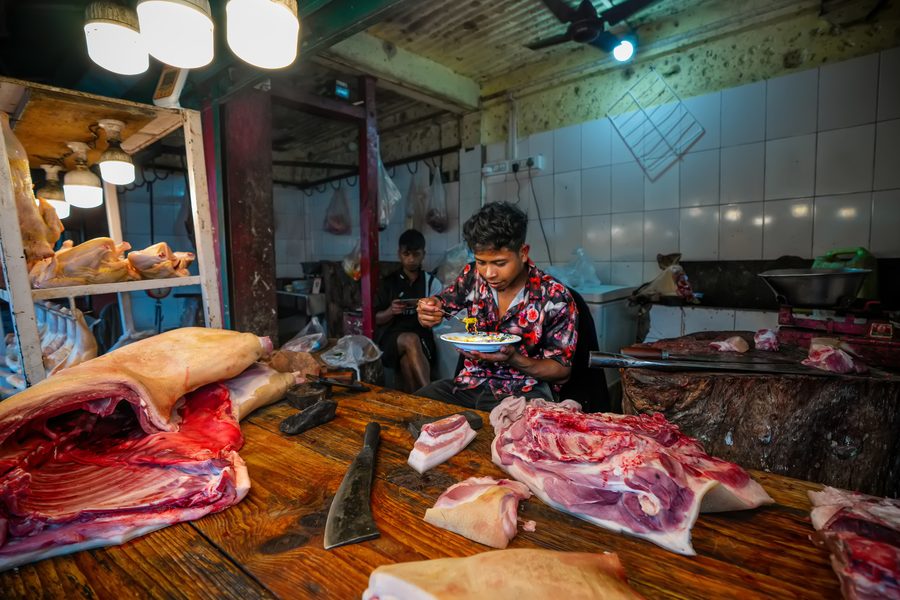 Butcher at a market stall in Shillong