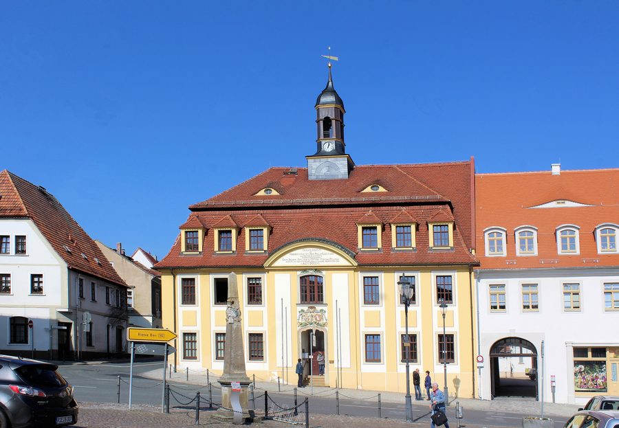 Town hall and postal milestone on the market square in Strehla