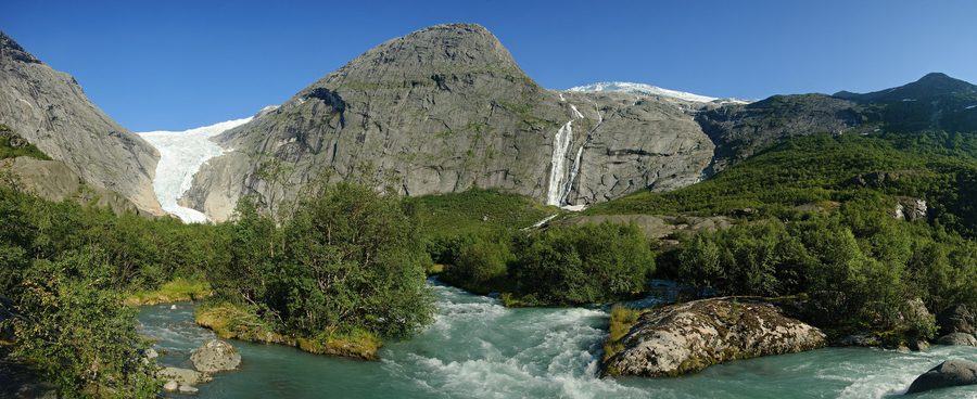Briksdalsbreen in Briksdal with valley, waterfall and river