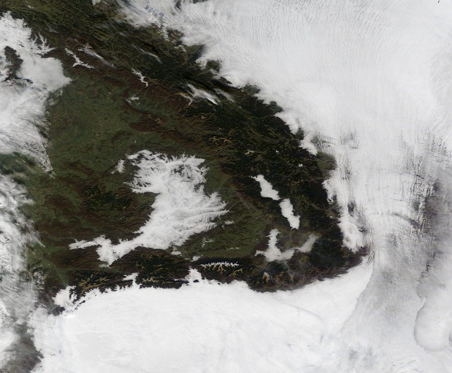Satellite image of the Carpathians, surrounded by mist and clouds.