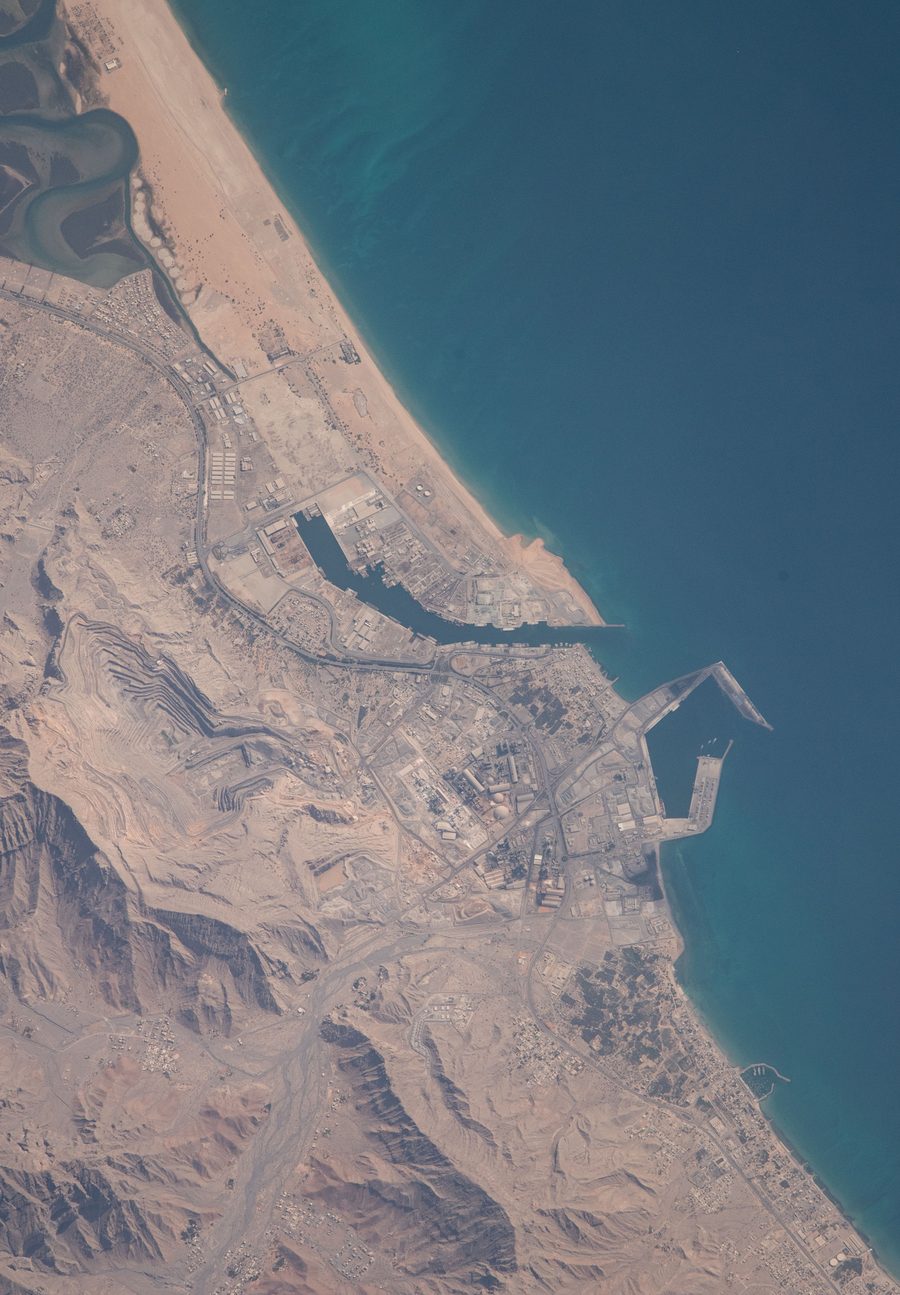 Aerial view of the coast of Ras Al Khaimah on the Arabian Gulf with a mountain ridge in the background