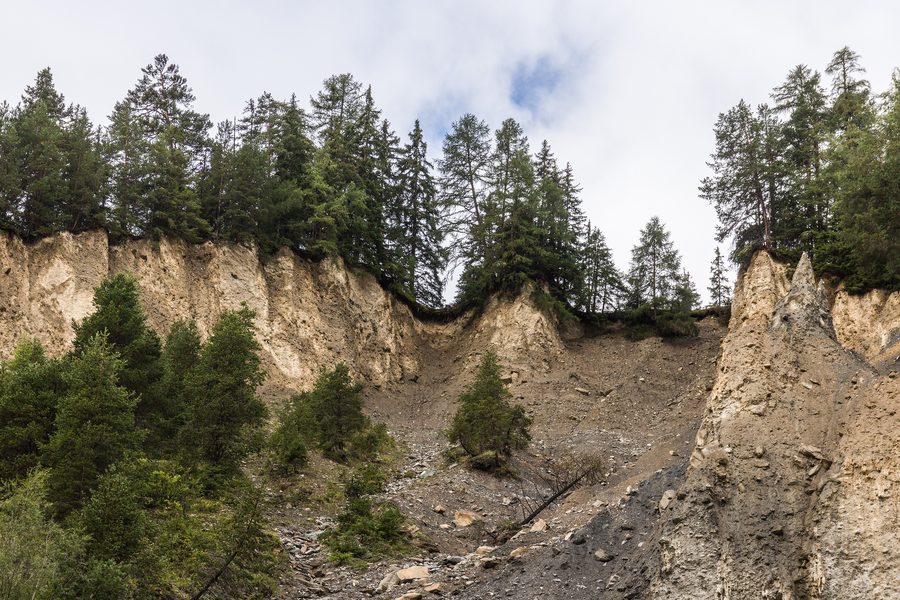 Eroded landscape above the mountain road from Sent to Val Sinestra