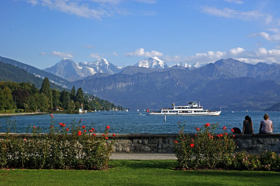 Schadau Park with a view of Schadau Castle, Lake Thun and the Bernese Alps