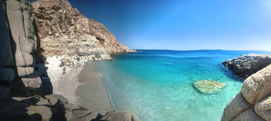 Seychelles Beach on Ikaria with turquoise water and rocky coastline