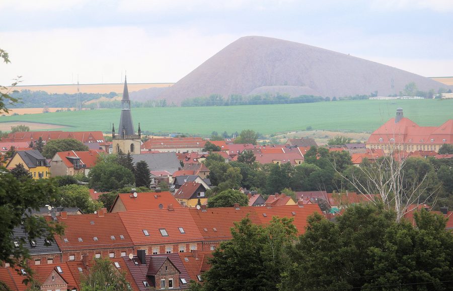 View of St. Anne's Church and the Fortschrittschacht spoil heap in Lutherstadt Eisleben