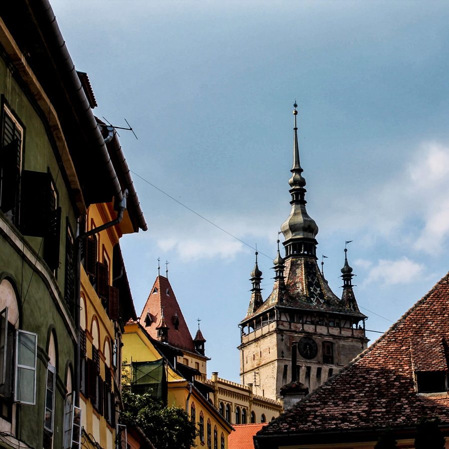 Clock Tower of Sighișoara seen from an adjacent alley