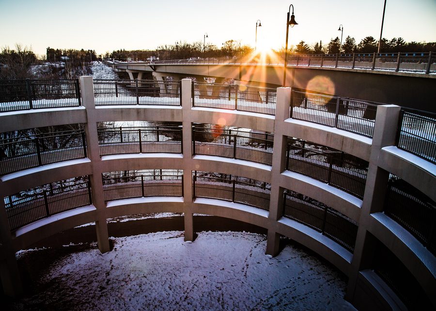 The Mississippi River Trail rises from Lions Park toward the Sauk Rapids Regional Bridge in Minnesota.