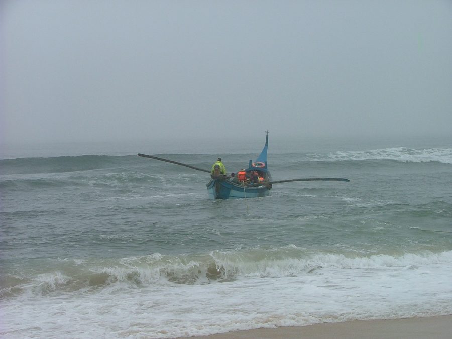 Boat leaving the beach of Praia de Vagueira for the arte xavega fishery