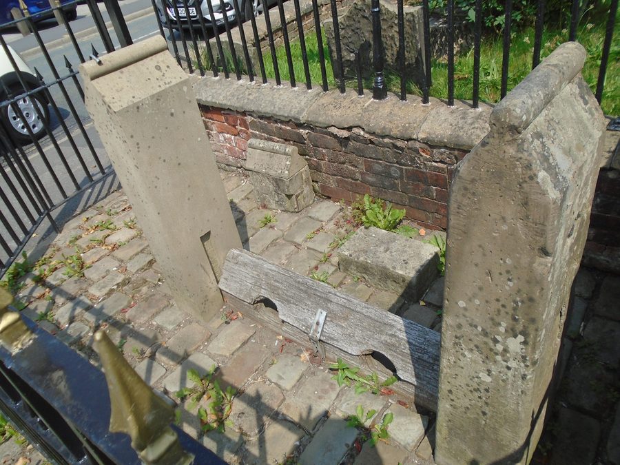 Grade II listed stocks at St Luke's Church, Lowton