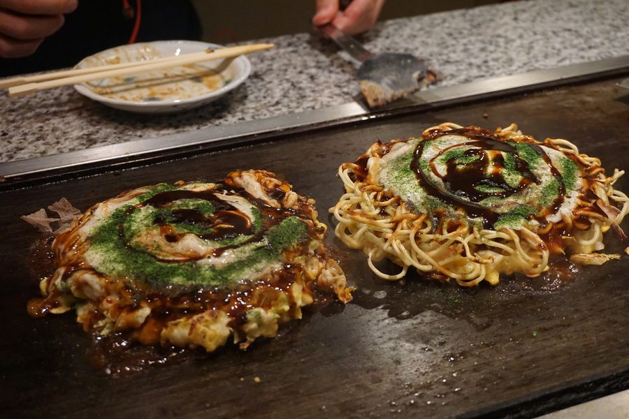 Okonomiyaki on a teppan grill plate in Osaka
