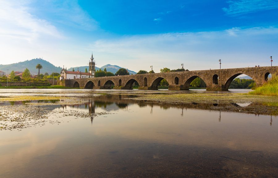 Historic stone bridge over the Lima River in Ponte de Lima, Portugal