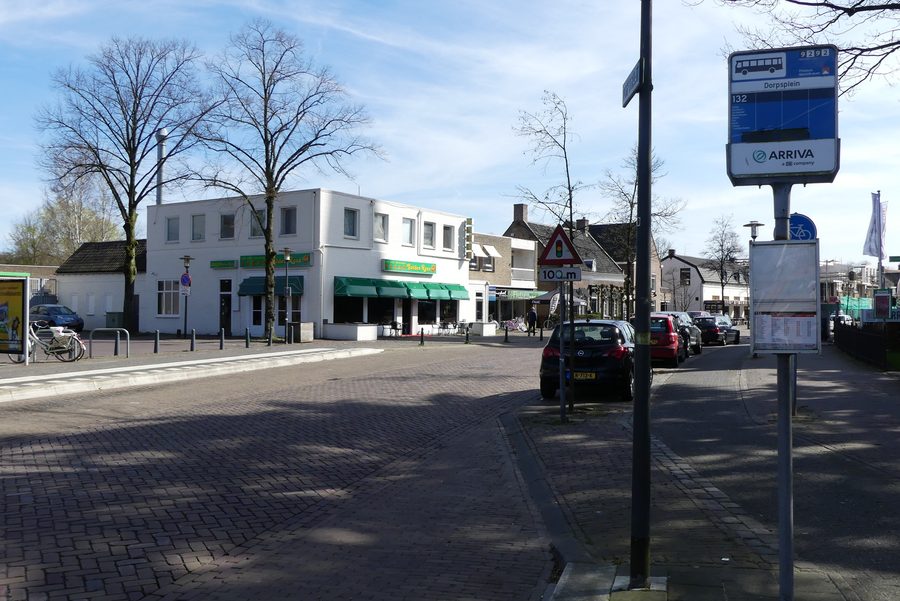 The Dorpstraat in Ulvenhout with bus stop and restaurant