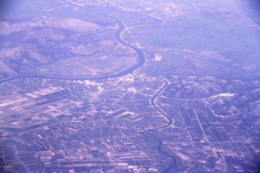 Aerial view of the Neretva Delta with the river and large agricultural fields in Croatia