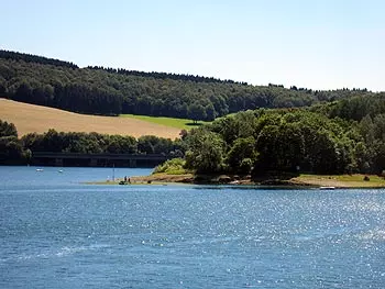 Biggesee with wooded shore and bridge